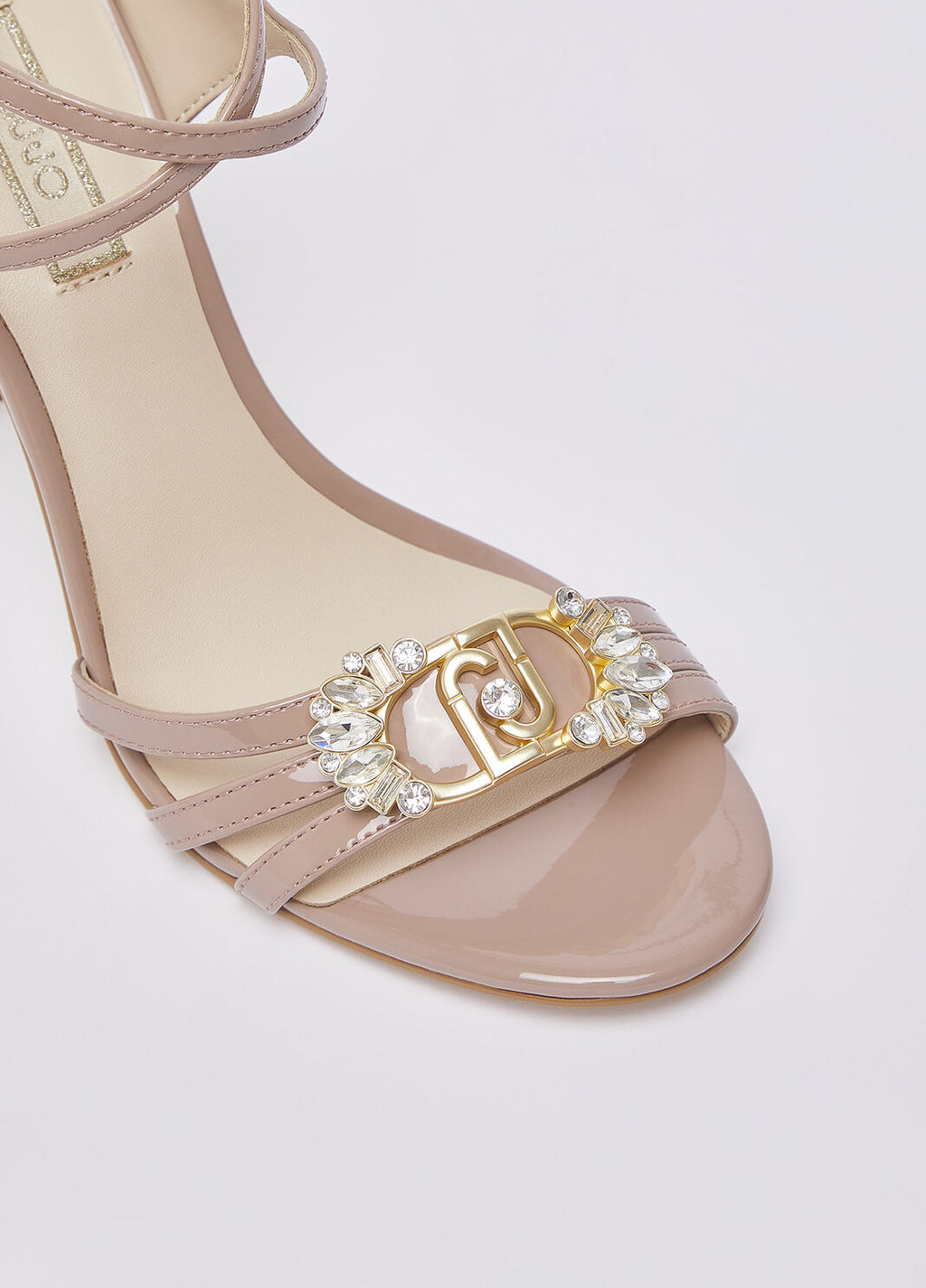Patent leather sandals with bejewelled logo