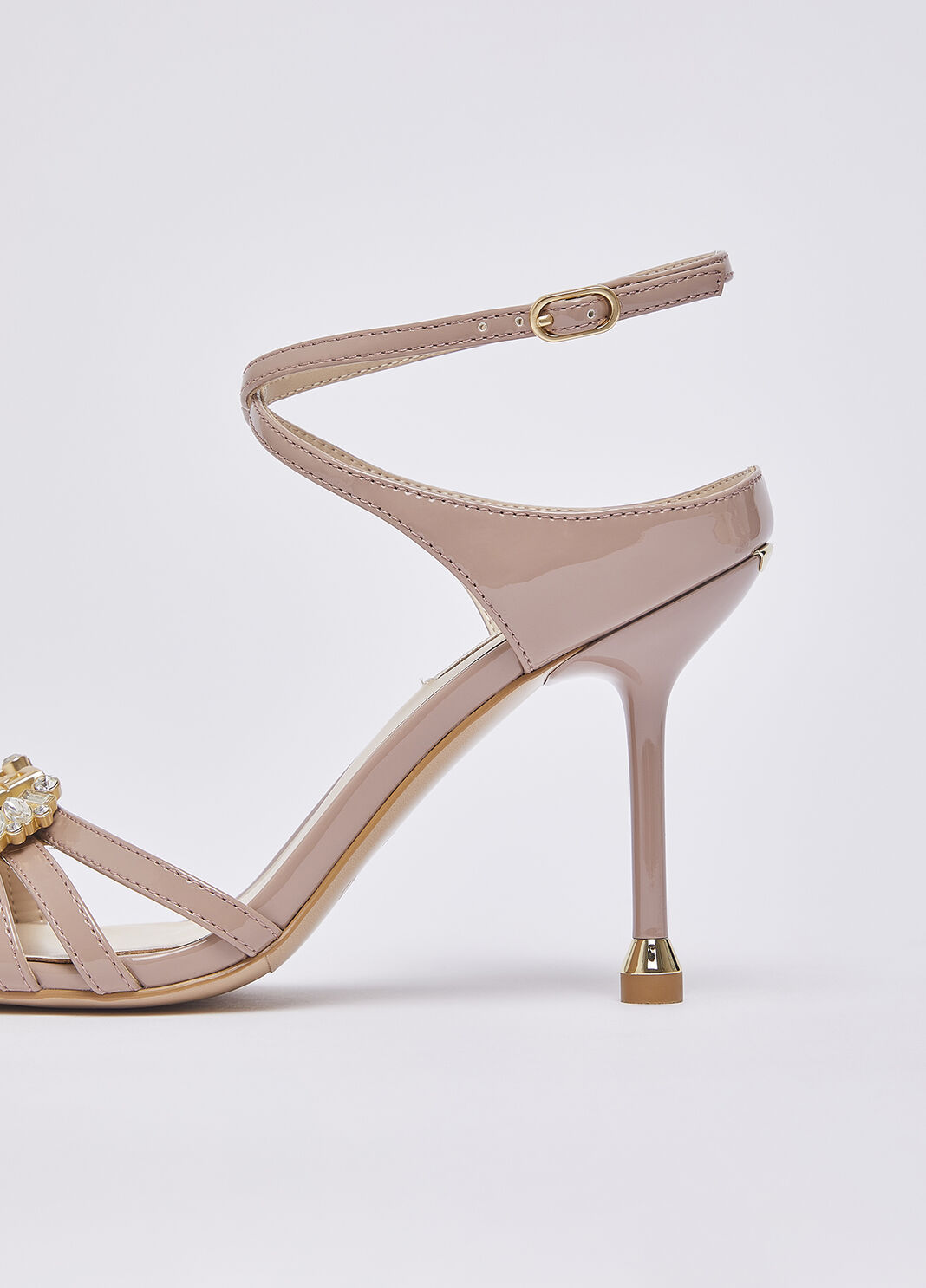 Patent leather sandals with bejewelled logo