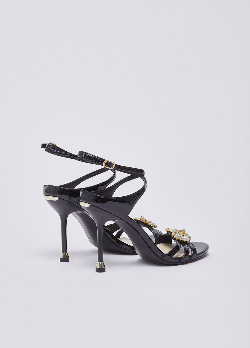 Patent leather sandals with bejewelled logo